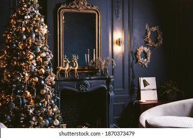 Interior Of Cozy Room Decorated In Christmas Happy New Year Style. Fireplace. No People. An Empty Sofa, Christmas Tree With Presents Under It. Selective Focus. Happy NY Mood