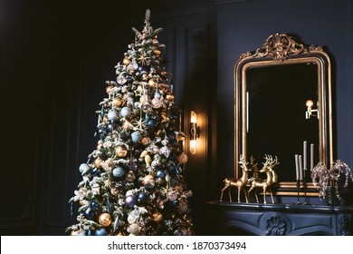 Interior Of Cozy Room Decorated In Christmas Happy New Year Style. Fireplace. No People. An Empty Sofa, Christmas Tree With Presents Under It. Selective Focus. Happy NY Mood