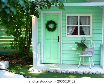  Interior Cozy Veranda House  With Chair And Basket Flowers. Decor Outdoor Of Summer Yard. Facade House Decorated For Autumn Holidays. Exterior Wooden Porch Home With Garden Furniture. 
Thanksgiving, 