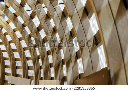 The Interior of Curved Diagonal Lines are made of the Wooden Composite with the Facade Design Architecture. Structure Perspective View of Softwood Curved Pergola. Sawn Arches, Design Architecture.