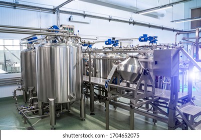 Interior of dairy factory with fermentation tank. Technology equipment at dairy farm. Sterile production.