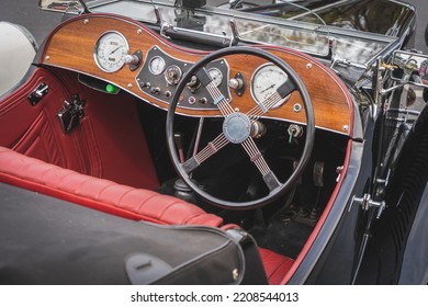 Interior, dashboard and right hand drive of a vintage or retro car from the 1920's and 30's. Typical UK right hand drive. Convertible car or with removable roof. Mobility concept. - Powered by Shutterstock