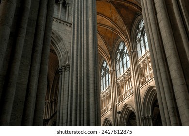 Interior decoration of a Catholic church. Stained glass, windows, statues, vaults. - Powered by Shutterstock