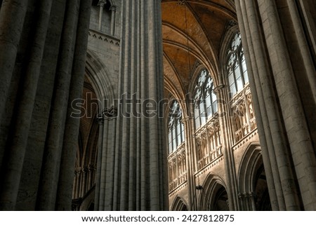 Interior decoration of a Catholic church. Stained glass, windows, statues, vaults.