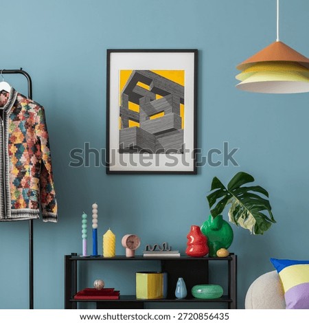 Interior desgin of modern living room interior with mock up poster frame, colorful decorations and accessories, plants, sofa, coffee table. Blue wall. Home decor. Template