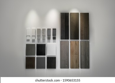 Interior Design Choice Of Condo Finishes For Kitchen Cabinets, Countertop And Floor. Quartz And Hardwood Flooring Samples At Home Improvement Store Showroom House Remodeling Renovation Stone Surfaces.