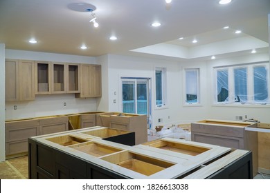 Interior design construction of kitchen remodel with cabinet maker installing home improvement custom