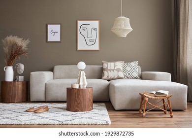 Interior design of cozy living room with stylish sofa, coffee table, dired flowers in vase, mock up poster, carpet, decoration, pillows, plaid and personal accessories in modern home decor. Template. - Shutterstock ID 1929872735