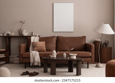 Interior design of cozy living room interior with mock up poster frame, brown sofa, wooden coffee table, chess prints rug, stylish lamp and personal accessories. Home decor. Template.