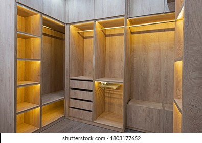Interior design decor furnishing of luxury show home bedroom showing walk in wooden wardrobe closet furniture - Shutterstock ID 1803177652
