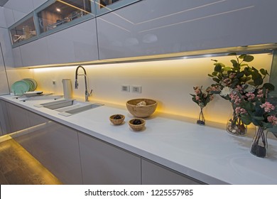 Interior design decor showing modern kitchen and cupboards in luxury apartment showroom