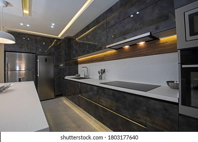 Interior design decor showing modern kitchen with cupboards in luxury apartment showroom