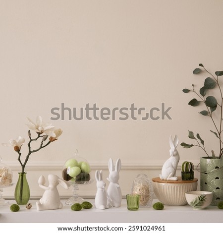 Interior design of easter living room interior stylish sideboard, colorful easter eggs, easter bunny sculpture, vase with leaves, magnolia and personal accessories Home decor. Template.