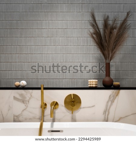 Interior design of elegant bathroom space with gold bathroom faucets, bath, blue and pink tiles, classic white bath, buble candle, brown wase with dried flowers. Home decor. Template. 