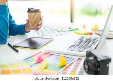 interior design or graphic designer renovation and technology concept - woman working with colour samples for selection. at workplace choosing colour swatches, closeup. Creative people  - Shutterstock ID 1120636232