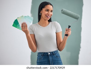 Interior Design, Green Paint And Woman Doing Home Renovation With Paintbrush Roller And Color Cards In Hand. Decoration, Home Improvement And Creative Black Woman Excited For Painting Wall And Diy