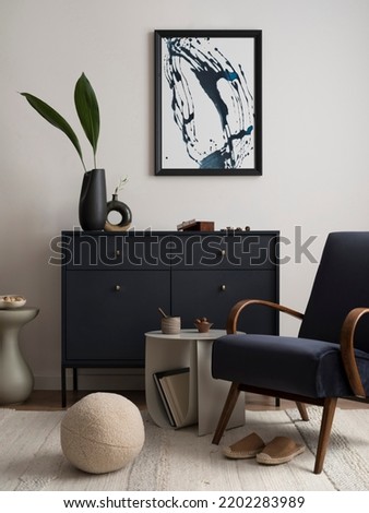Interior design of harmonized living room with blue commode, velvet armchair, coffee table, mock up poster frame, side table, decoration and personal accessories. Creative home decor. Template. 