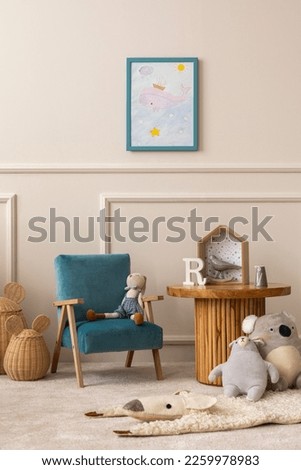 Interior design of kids room with mock up poster frame, round wooden table, blue armchair, plush toys, animal rug, wooden blockers, wicker basket and personal accessories. Home decor. Template.
