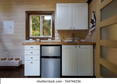 Interior Design Of A Kitchen In A Tiny Rustic Log Cabin.