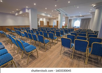 Interior Design Of Large Conference Meeting Room In Luxury Hotel With Rows Of Chairs