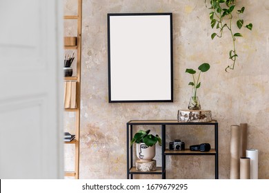 Interior design of living room with black poster mock up frame, shelf, cacti, plant, books, photo camera, wooden ladder and elegant personal accessories in stylish home decor.