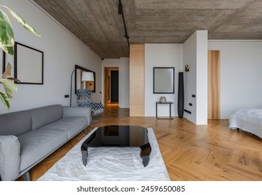 Interior design of living room with couch and coffee table on wood flooring