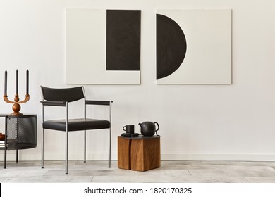 Interior design of modern living room with black stylish commode, chair, mock up art paintings, copy space, decorations and elegant accessories in home decor. Template.