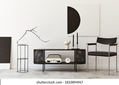 Interior Design Of Modern Living Room With Black Stylish Commode, Chair, Mock Up Art Paintings, Lamp, Book, Candlestick, Decorations And Elegant Accessories In Home Decor. Template.