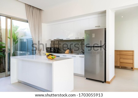 Interior design of open space dining room and kitchen in pool villa, house, home, condo and apartment feature kitchenette