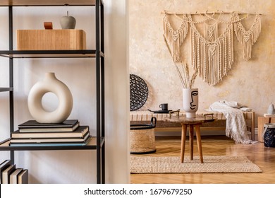 Interior Design Of Oriental Living Room With Beige Macrame, Coffee Table, Design Furniture, Shelf, Carpet And Elegant Personal Accessories In Modern Home Decor.