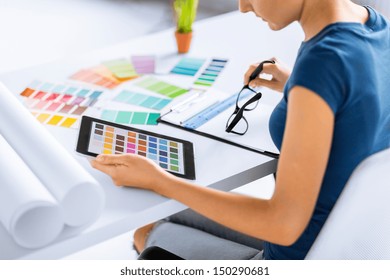 interior design, renovation and technology concept - woman working with color samples for selection - Powered by Shutterstock