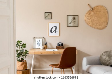 Interior Design Of Scandinavian Open Space With Mock Up Photo Frames, Wooden Desk, Gray Sofa, Plant, Books Office And Personal Accessories. Stylish Neutral Home Decor. Beige Walls. Template.