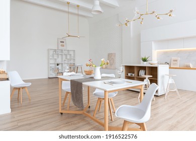 Interior Design Spacious Bright Studio Apartment In Scandinavian Style And Warm Pastel White And Beige Colors. Trendy Furniture In The Living Area And Modern Details In The Kitchen Area.