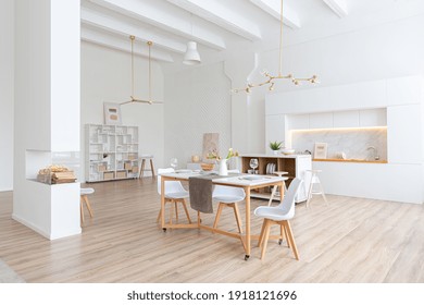 Interior Design Spacious Bright Studio Apartment In Scandinavian Style And Warm Pastel White And Beige Colors. Trendy Furniture In The Living Area And Modern Details In The Kitchen Area.