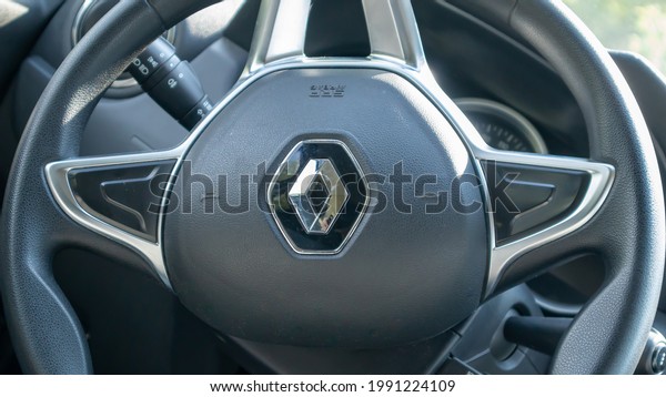 Interior design and\
steering wheel with logo close-up inside the car. The car is\
produced by the French company Renault. Renault Duster salon.\
Ukraine, Kiev - June 15,\
2021