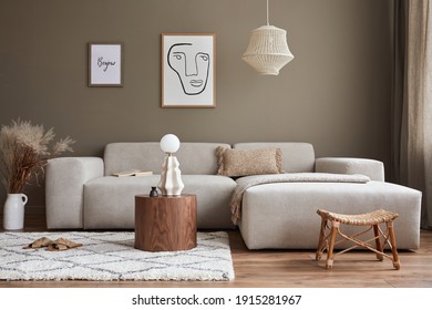 Interior design of stylish living room with modern neutral sofa, mock up poster farmes, dried flowers in vase, coffee tables, decoration and elegant personal accessories in home decor. Template. - Shutterstock ID 1915281967