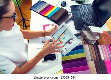 Interior designer, decorator, choosing  material samples in studio - Powered by Shutterstock