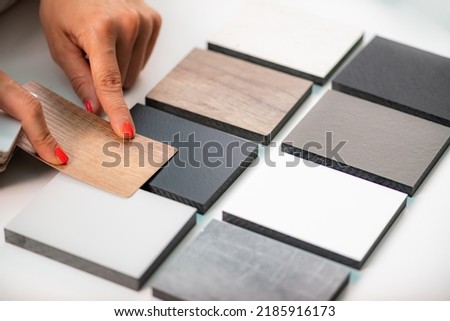 Interior designer matching material samples. Choosing compact and worktop colors 