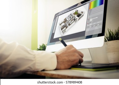 Interior Designer Working With Computer. All Screen Graphics Are Made Up.