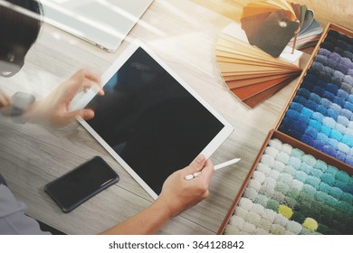  Interior Designer Working With Digital Tablet And New Modern Computer Laptop With Sample Material On Wooden Desk As Concept