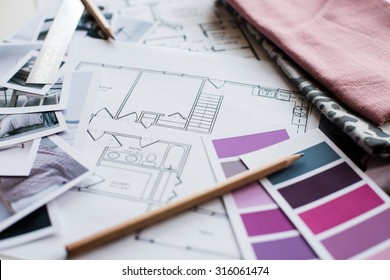 Interior Designer's Working Table, An Architectural Plan Of The House, A Color Palette, Furniture And Fabric Samples In Grey And Pink Color. Drawings And Plans For House Decoration.