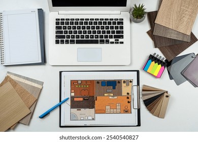 Interior designer's working table with laptop tools wooden color sampler and blueprints of the project. All equipment and material sample for perfect home renovation  - Powered by Shutterstock