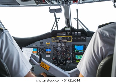 Interior details of a water plane with pilot and co pilot on board while flying. The photography is a demonstration of team work. - Powered by Shutterstock