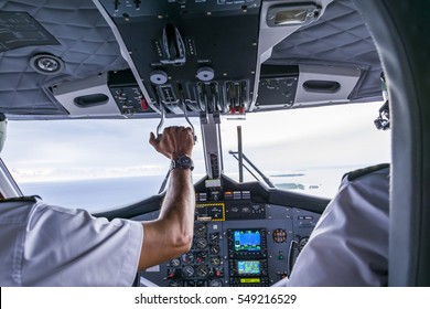 Interior details of a water plane with pilot and co pilot on board while flying. The photography is a demonstration of team work. - Powered by Shutterstock