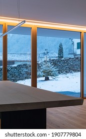 Interior Of A Dining Room, With A Large Bay Window, No One Inside And Outside There Is Snow