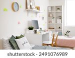 Interior of dorm room with beds, table and sticky notes