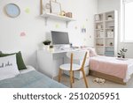 Interior of dorm room with beds, table and sticky notes