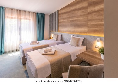 Interior of a double bed hotel bedroom in modern luxury hotel in the morning