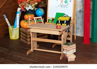 Interior Of Elementary School. Chalkboard, Backpack, Pencils And Stationery On Classroom. Teachers Day. Back To School. Empty Classroom With Blackboard And Wooden Table. Kindergarten. 