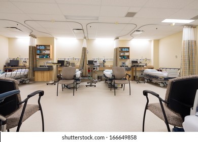 Interior of empty beds and chairs in post surgery unit